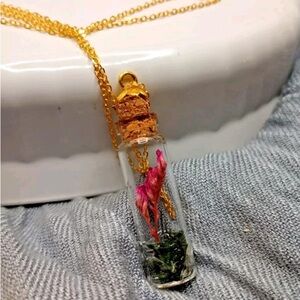Potion bottle pendant necklace with real preserved flower and quartz